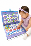 Toddler playing with the Arabic-English talking book