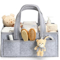 Grey felt nursery diaper caddy with teddy charm, filled with baby essentials