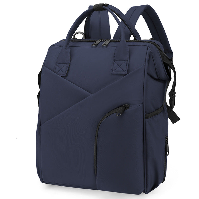 Navy diaper bag backpack with front zip pockets