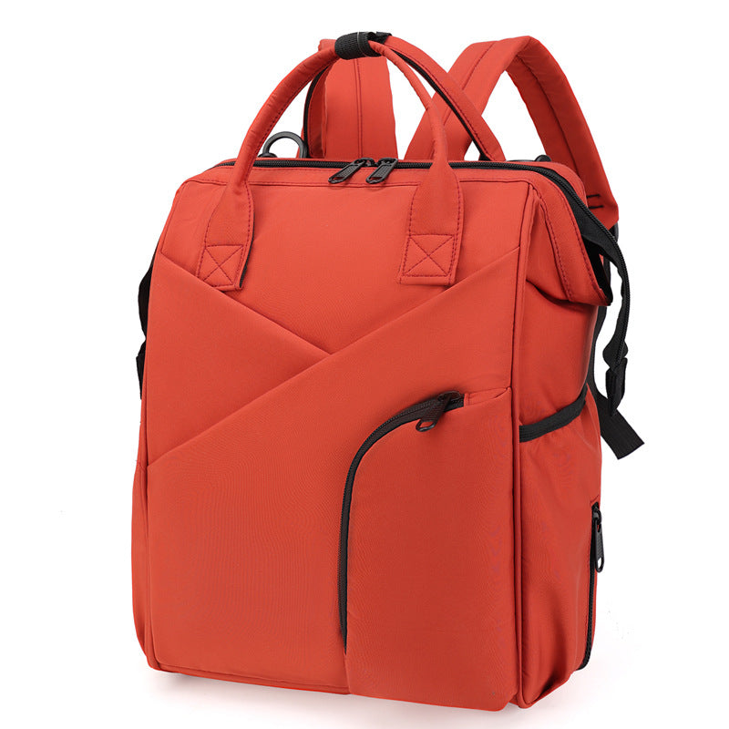 Red diaper bag backpack with front zip pockets