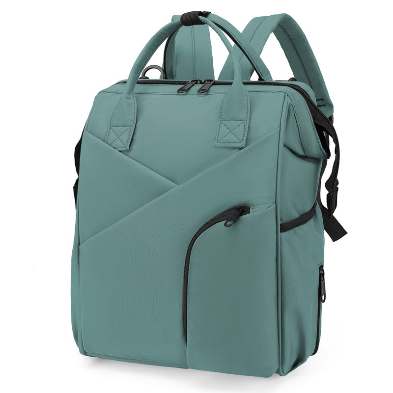 Green diaper bag backpack with front zip pockets