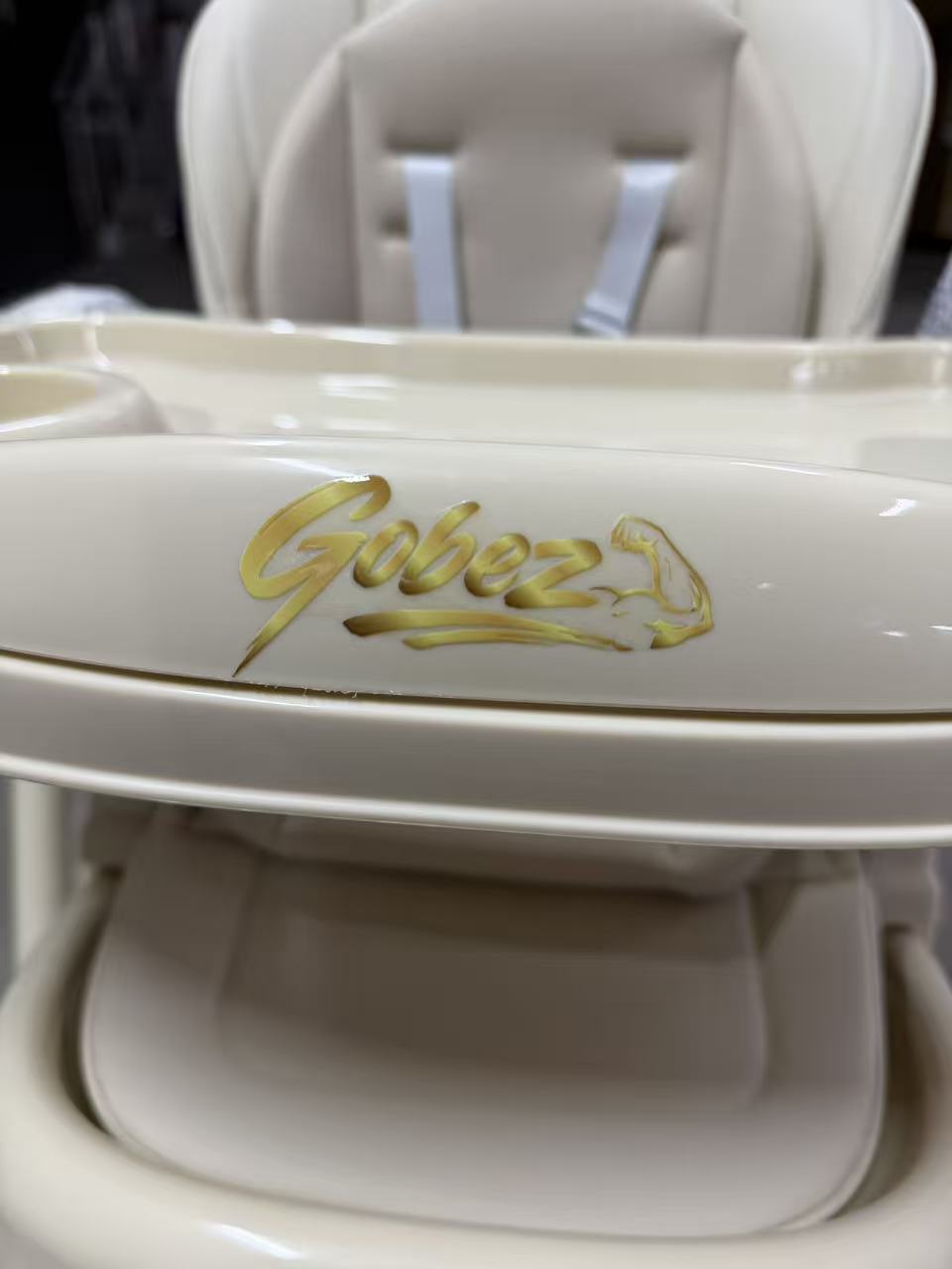 Gold GOBEZ logo on the tray of the 5-in-1 electric baby high chair