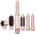 5-in-1 hot air styler and hair dryer brush set in blush pink with auto-curl barrels, volume brush, smoothing brush and dryer nozzle