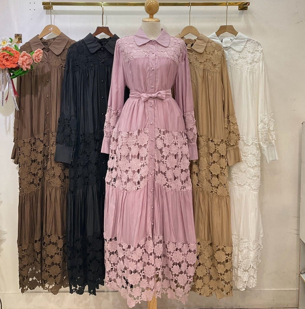 Lace floral maxi dresses on a rail in several colours